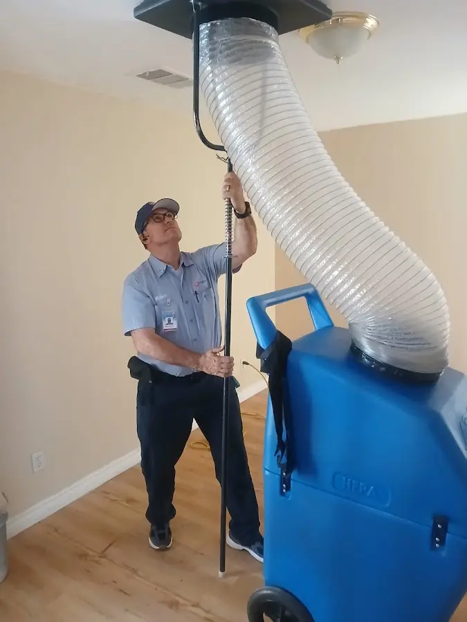 Furnace Tune-Up technician using HEPA equipment in Casa Grande
